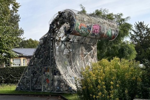 A sculpture by Wren Miller entitled ‘Another Wave is Possible’ on display in Royal Fort Gardens. The sculpture is of a 4 metre high wave made from a metal frame and filled with rubbish.